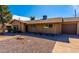 Single-story home with desert landscaping, featuring a driveway and brick facade under a clear blue sky at 8519 E Rancho Vista Dr, Scottsdale, AZ 85251