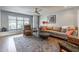 Comfortable living room with a large window, neutral colored walls, hardwood flooring, and comfortable seating at 8519 E Rancho Vista Dr, Scottsdale, AZ 85251