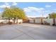 Spacious backyard with large concrete area, block fencing, and mature landscaping, offering privacy and functionality at 9245 S 4Th Ave, Phoenix, AZ 85041