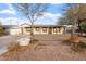 Single-story home showcasing desert landscaping and a covered porch at 9245 S 4Th Ave, Phoenix, AZ 85041
