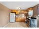 Kitchen with wooden cabinets, tile flooring, stainless steel appliances, and sink at 9245 S 4Th Ave, Phoenix, AZ 85041