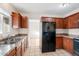 Well-lit kitchen with wood cabinets and stainless steel sink at 9245 S 4Th Ave, Phoenix, AZ 85041
