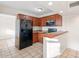 Efficient kitchen featuring wood cabinets and modern appliances at 9245 S 4Th Ave, Phoenix, AZ 85041