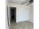 A bedroom that features tile flooring, a ceiling fan, and a large closet at 9318 E El Paso St, Mesa, AZ 85207