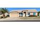 Charming home featuring desert landscaping, a spacious driveway, and a two-car garage at 9318 E El Paso St, Mesa, AZ 85207