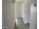 Neutral-colored hallway showcasing modern flooring and freshly painted walls and trim at 9318 E El Paso St, Mesa, AZ 85207