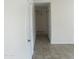 Bright hallway featuring tile floors and plenty of closet space at 9318 E El Paso St, Mesa, AZ 85207