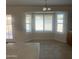 Light-filled kitchen nook features tile floors and a bay window with plantation shutters at 9318 E El Paso St, Mesa, AZ 85207