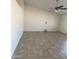 Bright living room features tile floors, a ceiling fan, and neutral walls at 9318 E El Paso St, Mesa, AZ 85207