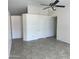 A bright living area featuring high ceilings, closet space, and tile floors at 9318 E El Paso St, Mesa, AZ 85207
