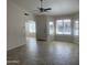 Open-concept living area featuring archways, neutral walls, and tiled floors at 9318 E El Paso St, Mesa, AZ 85207