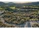Panoramic aerial captures the beautiful homes, golf course and lush landscape against the mountainous desert backdrop at 10020 E Relic Rock Rd # 18, Scottsdale, AZ 85262