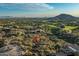 Beautiful view with desert homes and native vegetation with golf course and mountains in the background at 10020 E Relic Rock Rd # 18, Scottsdale, AZ 85262