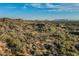 Expansive desert community showcasing custom homes nestled among indigenous vegetation and scenic landscape at 10020 E Relic Rock Rd # 18, Scottsdale, AZ 85262