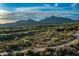 Broad aerial view with desert golf course, desert vegetation and mountains on a sunny day at 10020 E Relic Rock Rd # 18, Scottsdale, AZ 85262