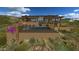 Rear exterior of the house showing desert landscaping, patio, and swimming pool at 10020 E Relic Rock Rd # 18, Scottsdale, AZ 85262