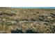 Desert property with desert vegetation and community in the distance at 10020 E Relic Rock Rd # 18, Scottsdale, AZ 85262