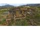 Luxury home featuring a private drive, balconies, and a pool, nestled within desert landscaping at 10020 E Relic Rock Rd # 18, Scottsdale, AZ 85262