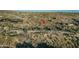 Desert property with desert vegetation and community in the distance at 10020 E Relic Rock Rd # 18, Scottsdale, AZ 85262