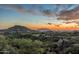 Desert landscape with stunning sunset view, golf course, and mountain backdrop at 10020 E Relic Rock Rd # 18, Scottsdale, AZ 85262