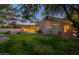 Spacious backyard with a pool, lush lawn, and view of the rear of the home at 10431 N 55Th Pl, Paradise Valley, AZ 85253
