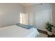 Clean bedroom featuring a comfortable bed, sliding closet doors, and neutral colors at 10431 N 55Th Pl, Paradise Valley, AZ 85253