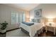 Inviting bedroom with a comfortable bed, shutters, and natural light at 10431 N 55Th Pl, Paradise Valley, AZ 85253
