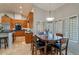 Dining area featuring ample windows, stylish light fixture, and dark table with matching chairs at 10431 N 55Th Pl, Paradise Valley, AZ 85253