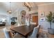 Open dining area with modern lighting, comfortable seating, and an adjacent living space at 10431 N 55Th Pl, Paradise Valley, AZ 85253