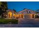 Charming single-story home featuring a three-car garage, well-maintained landscaping, and welcoming front porch at 10431 N 55Th Pl, Paradise Valley, AZ 85253