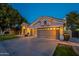 Lovely single-story home showcasing a three-car garage, and manicured front yard at 10431 N 55Th Pl, Paradise Valley, AZ 85253