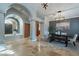 Spacious foyer showcasing archways, travertine floors, and a dining area at 10431 N 55Th Pl, Paradise Valley, AZ 85253