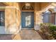 Welcoming entryway featuring a stylish blue double front door and elegant tile flooring at 10431 N 55Th Pl, Paradise Valley, AZ 85253