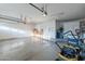 Spacious garage featuring ample storage, concrete flooring, and convenient garage door openers at 10431 N 55Th Pl, Paradise Valley, AZ 85253