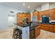 Spacious kitchen features a large island with bar seating, wine cooler, and stainless steel appliances at 10431 N 55Th Pl, Paradise Valley, AZ 85253