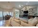 Open-concept living and dining area with fireplace, built-ins, and comfortable seating at 10431 N 55Th Pl, Paradise Valley, AZ 85253
