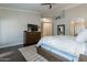Main bedroom with dark wood floors, a dark wood bed frame, and a dresser, for a cohesive design at 10431 N 55Th Pl, Paradise Valley, AZ 85253
