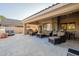 Outdoor living area with a covered patio, comfortable seating, and views of the backyard at 10431 N 55Th Pl, Paradise Valley, AZ 85253