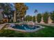 Beautiful backyard pool with rock features, mature trees, and well-maintained landscaping at 10431 N 55Th Pl, Paradise Valley, AZ 85253