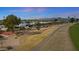 Scenic aerial view of a home adjacent to a golf course and walking path in a vibrant community at 10902 W Palmeras Dr, Sun City, AZ 85373