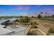 Rooftop patio area with a table and chairs overlooking the golf course and desert landscape at 10902 W Palmeras Dr, Sun City, AZ 85373