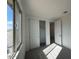 Bedroom with carpet flooring, closet with white sliding doors, and a window at 15773 W Hackamore Dr, Surprise, AZ 85387