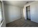 Bedroom with carpet flooring, closet with white sliding doors, and a window at 15773 W Hackamore Dr, Surprise, AZ 85387