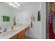 Bathroom with a single sink vanity, storage shelves, and a shower at 16402 N 31St St # 228, Phoenix, AZ 85032