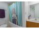 Bathroom featuring a shower/tub combination and a shark-themed curtain at 16402 N 31St St # 228, Phoenix, AZ 85032