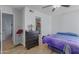 View of bedroom featuring a ceiling fan, wood-look floors, and a dresser at 16402 N 31St St # 228, Phoenix, AZ 85032