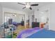Bedroom featuring a ceiling fan, mirrored closet doors, and an ensuite bathroom at 16402 N 31St St # 228, Phoenix, AZ 85032