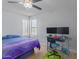 Bedroom featuring a ceiling fan, natural light, and a workstation, creating a comfortable and functional living space at 16402 N 31St St # 228, Phoenix, AZ 85032