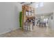 Open living space with a loft area, a unique surfboard accent, and an open floorplan connecting the living and dining areas at 16402 N 31St St # 228, Phoenix, AZ 85032