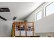 Upper loft area with a basketball hoop, storage and window, providing extra space with an open view of the living area at 16402 N 31St St # 228, Phoenix, AZ 85032